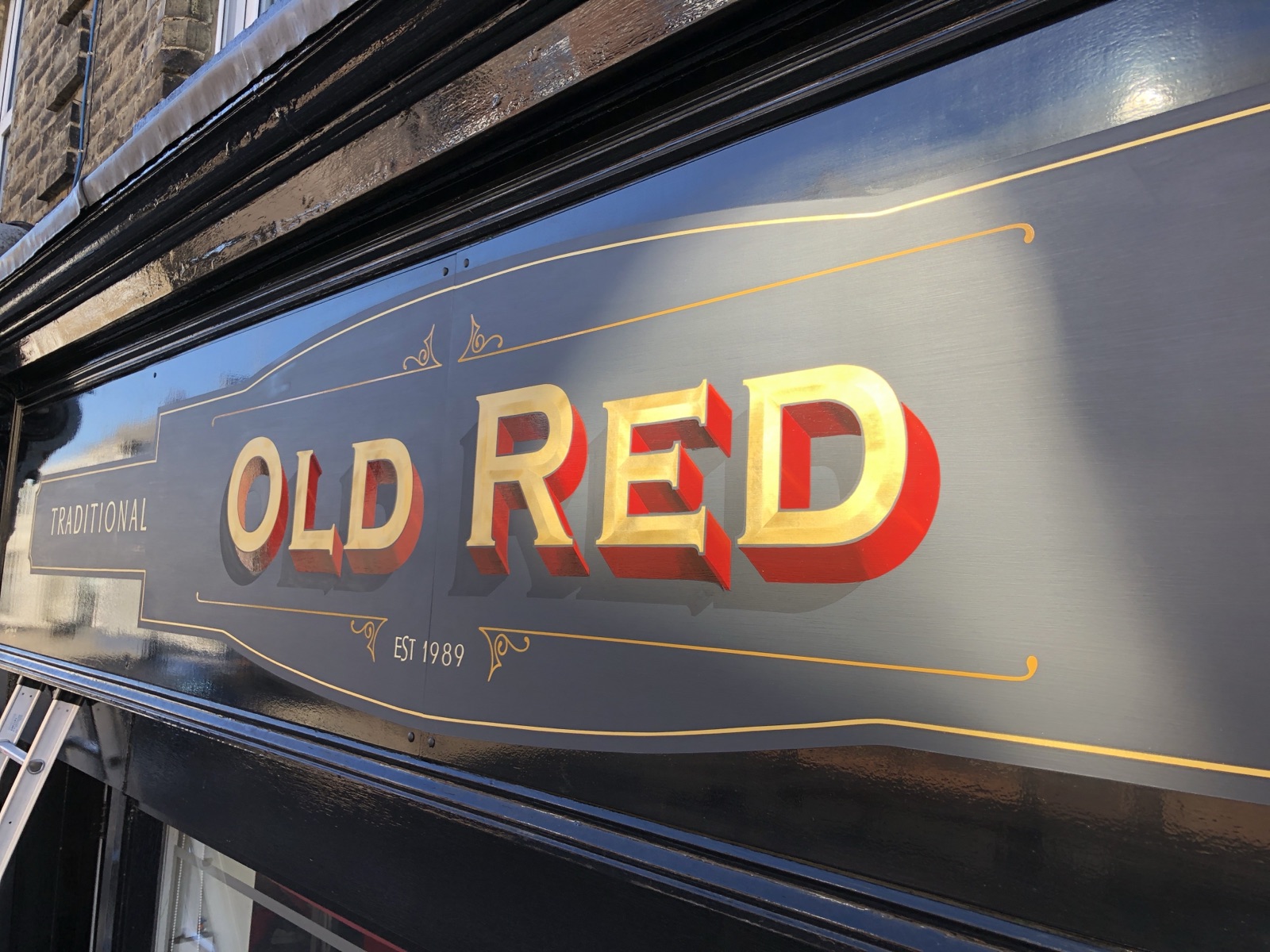Old Red — hand-painted and gilded lettering on glass