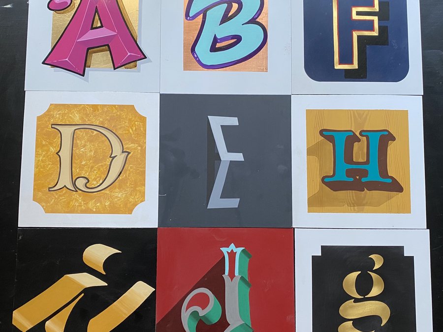 A grid of hand-painted letters worked up in a range of lettering styles, as demonstrated in The 26 Letters